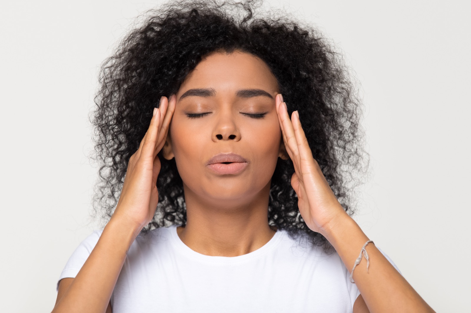 A woman breathing and calming down, finding relief from anxiety through therapy